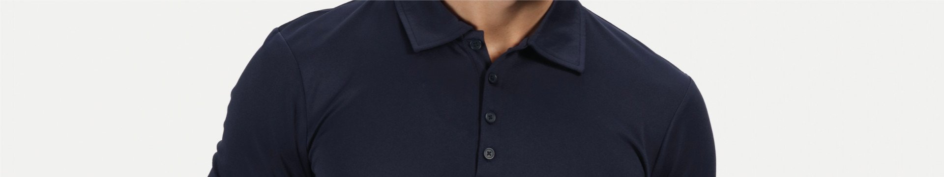 Close up image of a man wearing a black polo shirt